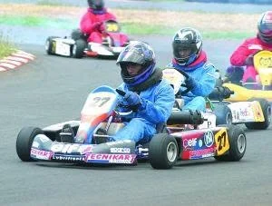Farhan Ghanty driving the front kart at Kart Loisir, with early TECNiKART lettering visible.